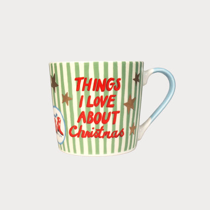 Mug with green stripes and red text on a pink background