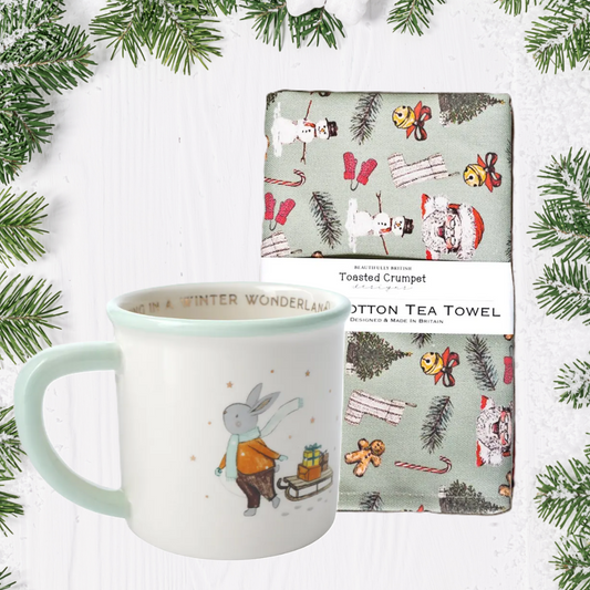 Mug and tea towel set with Christmas design on a white background