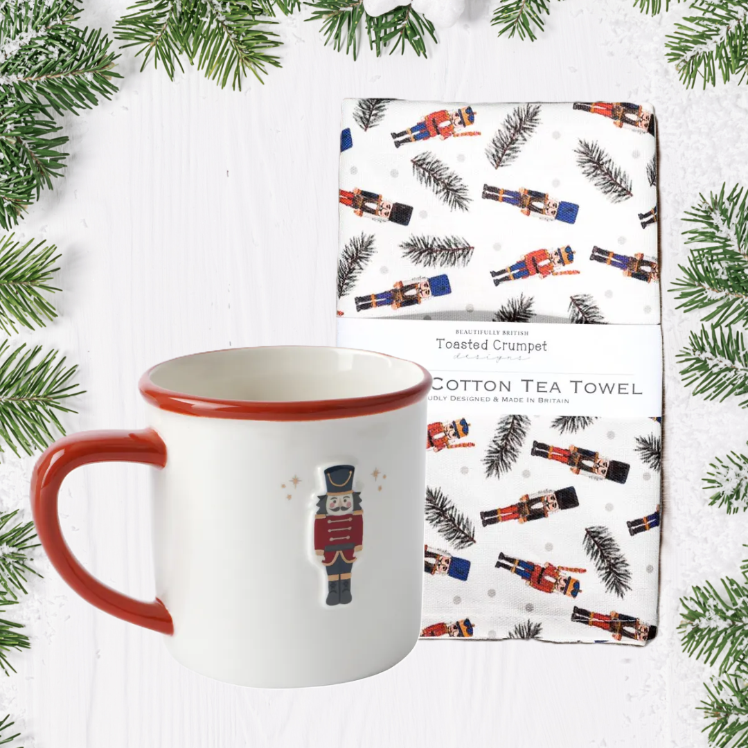 Mug and tea towel set with Nutcrackers pattern on white background