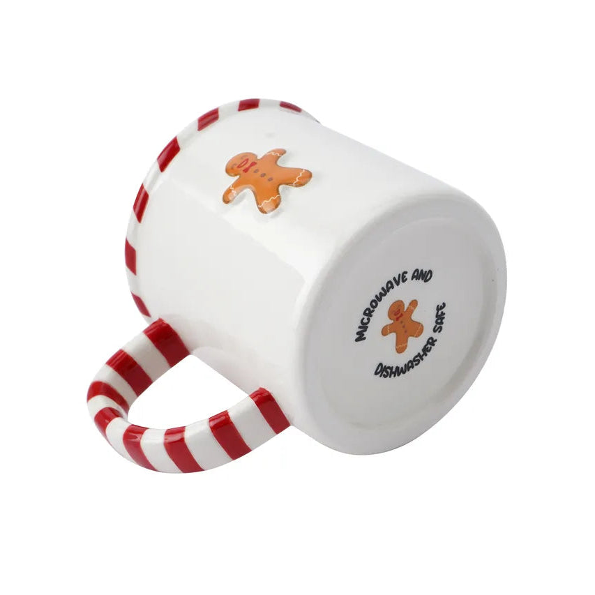 White mug with red and white striped handle featuring a gingerbread man design on a white background