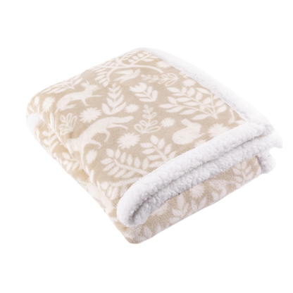 Floral patterned fleece throw with white border on a white background