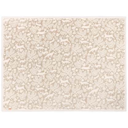 Beige patterned throw on a white background