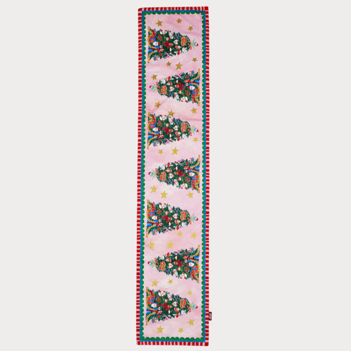 Decorative table runner with Christmas tree pattern on a light blue background