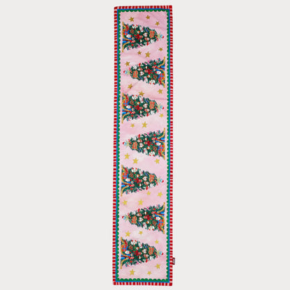 Decorative table runner with Christmas tree pattern on a light blue background